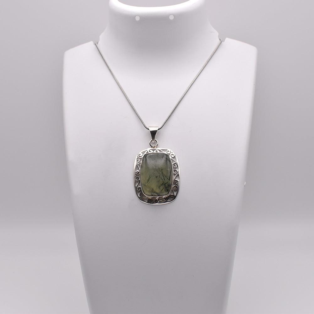 Prehnite Pendant on jewelry display