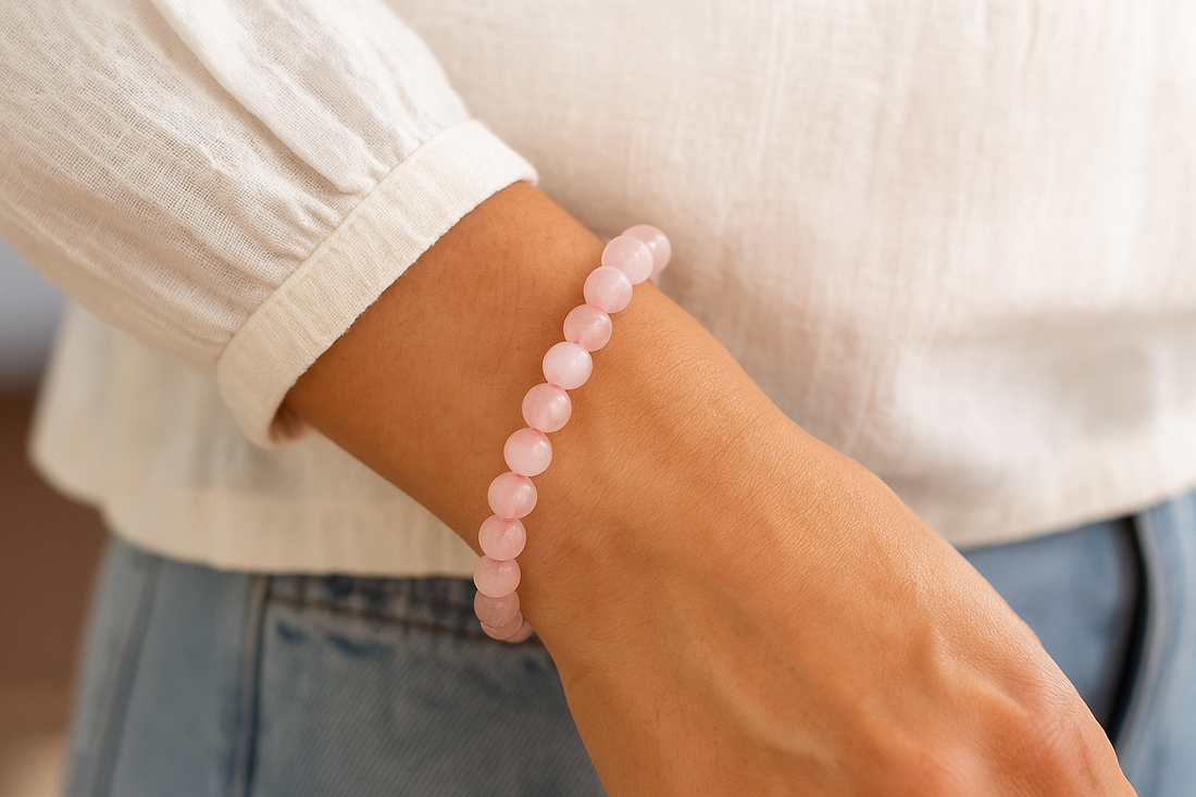 a person wearing rose quartz bracelet 