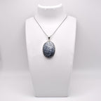 Dendritic Agate Pendant on jewelry display