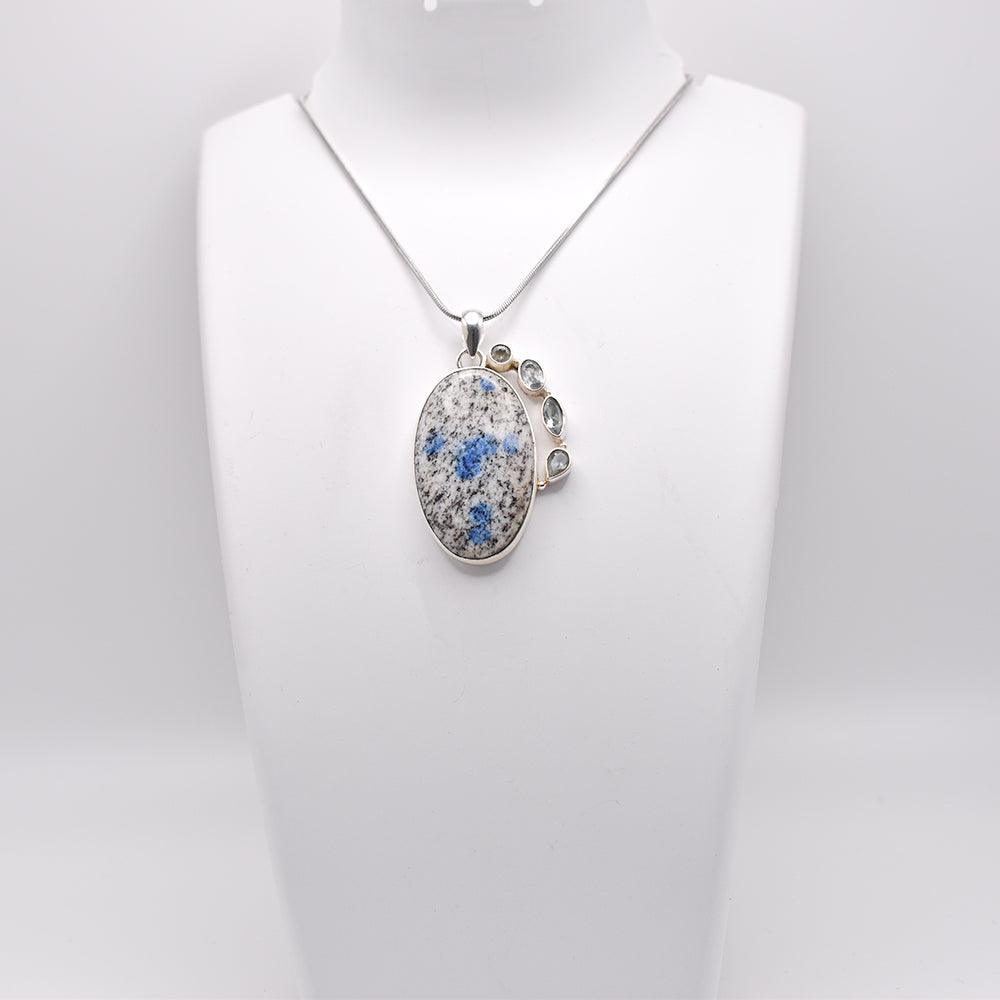 K2 Stone Pendant with chain on jewelry display 