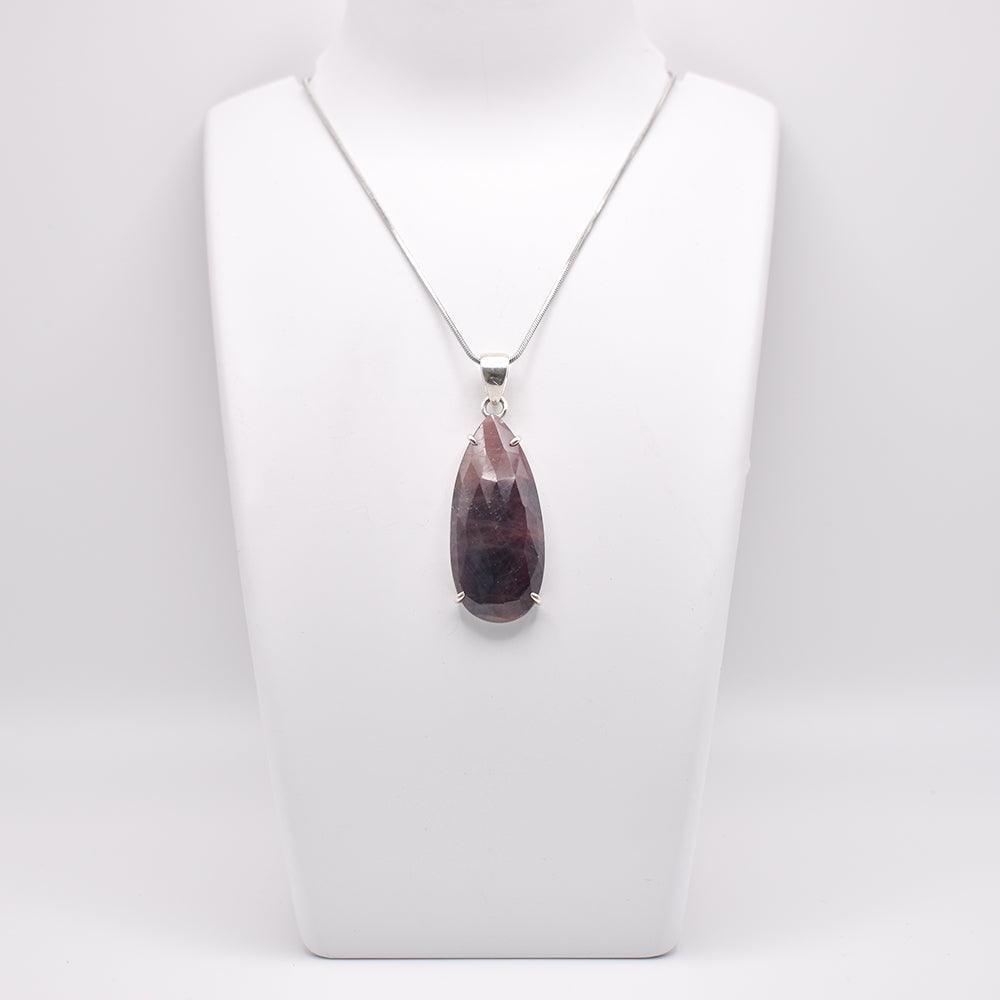 Ruby Pendant pear shaped on jewelry display