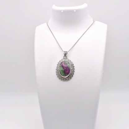 Ruby Zoisite Pendant on jewelry display 