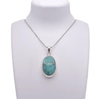 Turquoise Pendant on jewelry display 