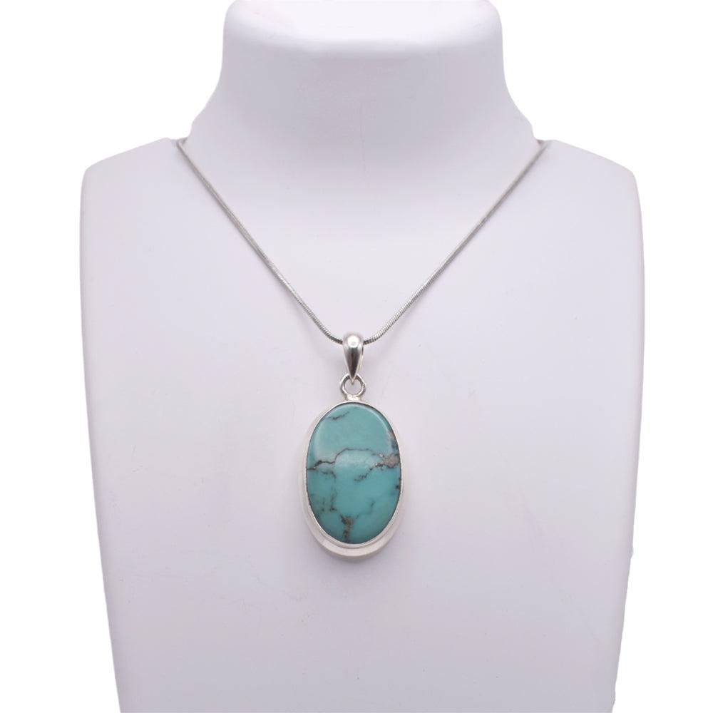 Turquoise Pendant on jewelry display 