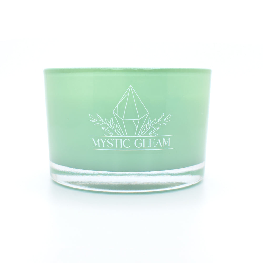 Green tea-scented crystal candle in frosted green jar with raw crystals