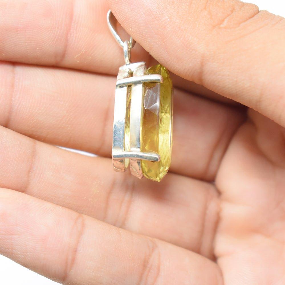 925 sterling silver lemon quartz yellow color pendant in hand side angle 
